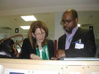 Lynne Featherstone looks at patient menus with Cecil Douglas